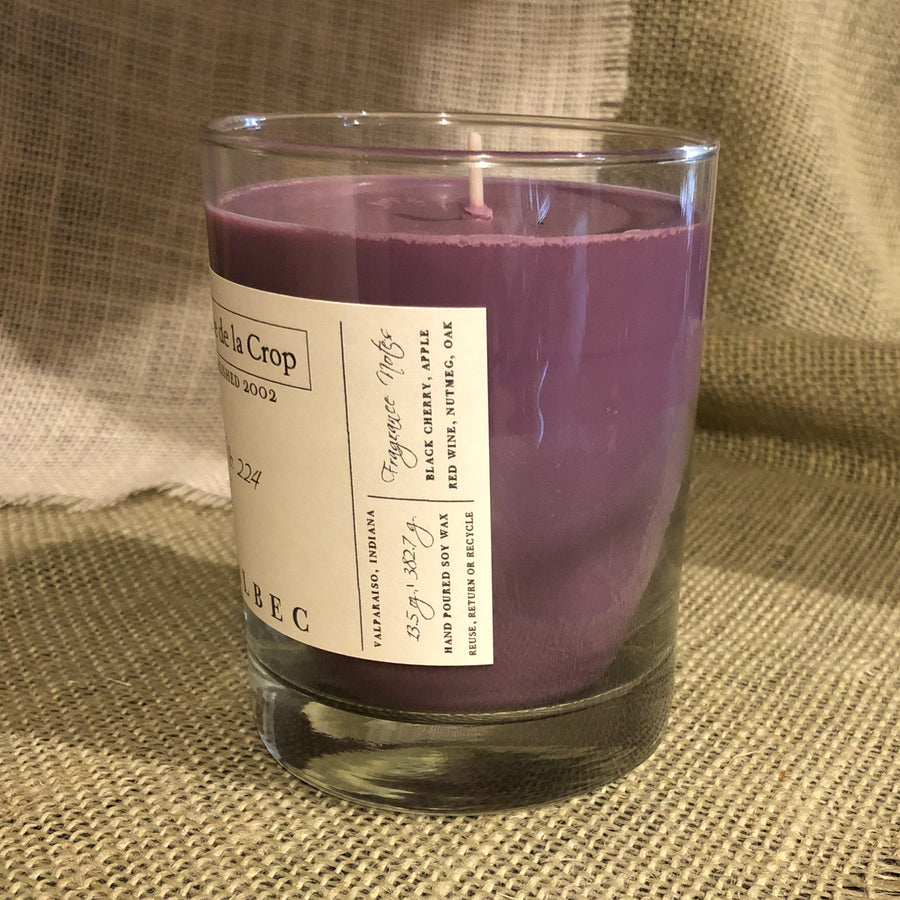 Malbec Soy Candle glass showing its side label