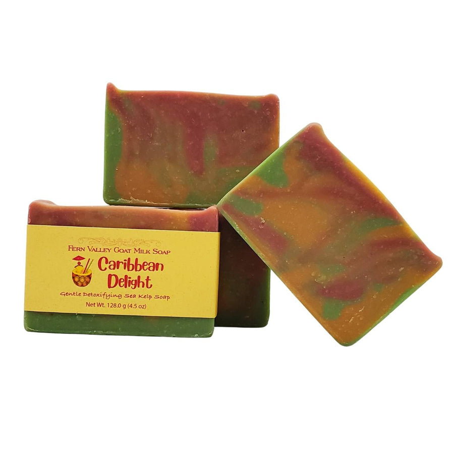 Caribbean Delight goat milk soap — labelled bar beside exposed cut surfaces