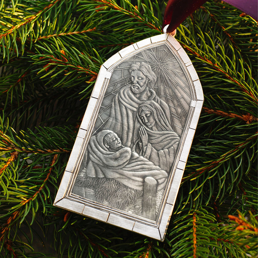 Styled display featuring Nativity Cathedral Window Ornament