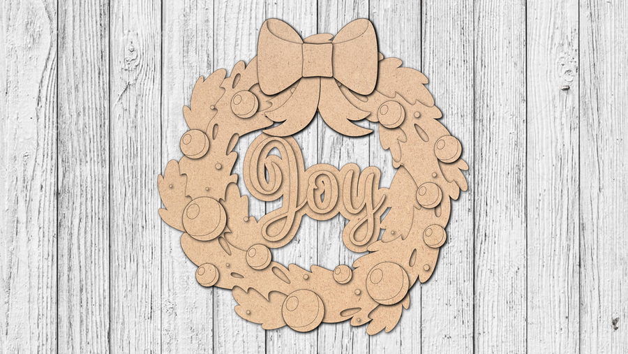 Unfinished Joy wreath door hanger with bow and ornament details