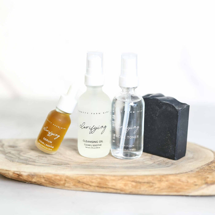 Clarifying face-care products arranged on a wooden tray