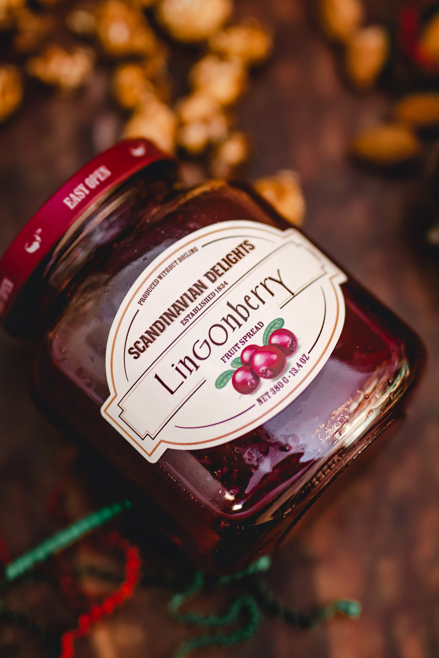 Scandinavian Delights lingonberry spread jar beside wrapped summer sausage