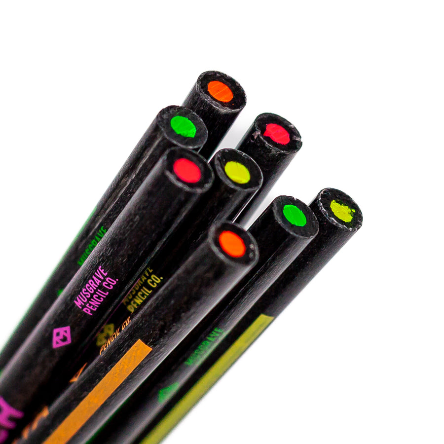 Colored core ends of eight black highlighter pencils