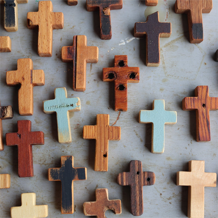Rugged wooden pocket crosses with visible reclaimed wood texture.