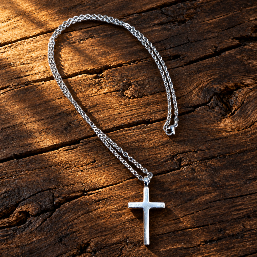 Classic Cross necklace arranged on a wooden surface