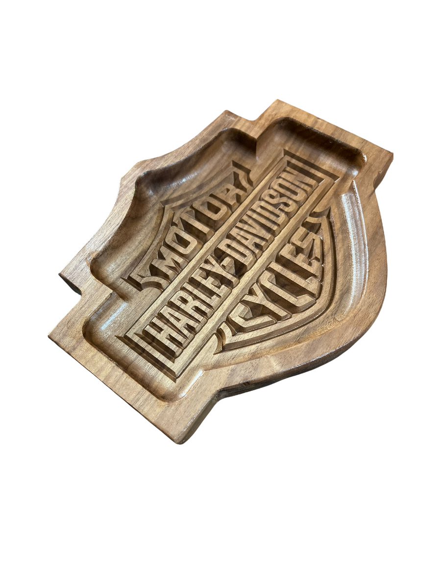 Angled view of shield-shaped engraved tray