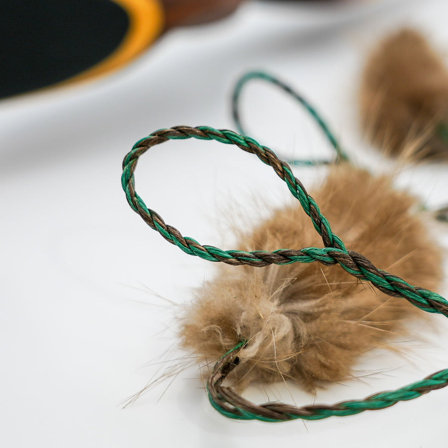 D97 Hunting Bowstring — bowstring loop beside fur silencer