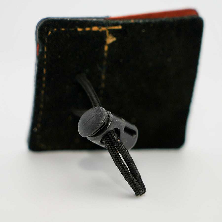 Shell Cordovan 3-Under Archery Tab — reverse side with adjustable cord