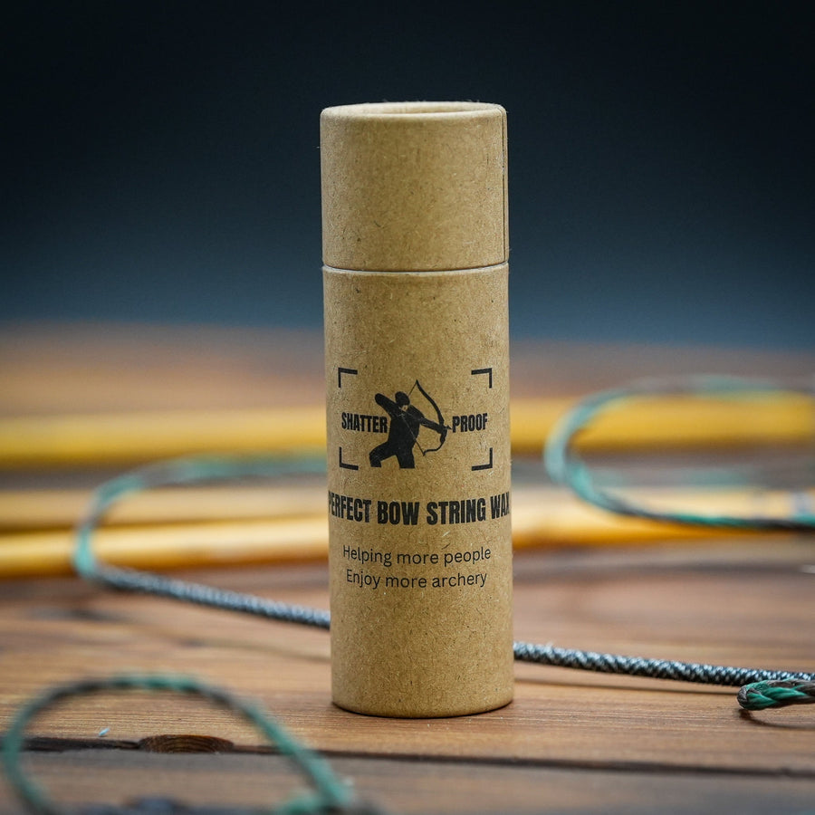 Sticky Perfect Bowstring Wax — closed wax tube on workbench