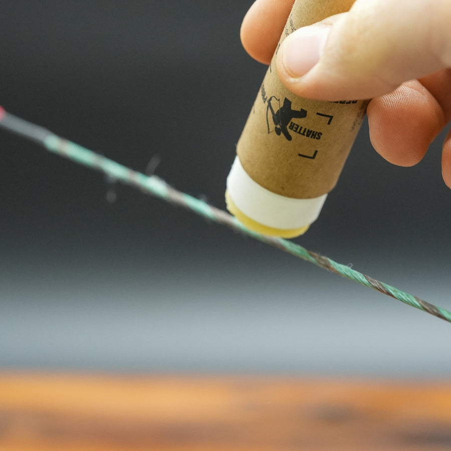 Sticky Perfect Bowstring Wax — wax being applied to bowstring