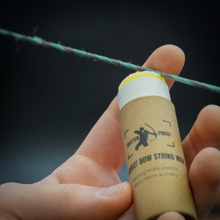 Sticky Perfect Bowstring Wax — wax tube held against bowstring