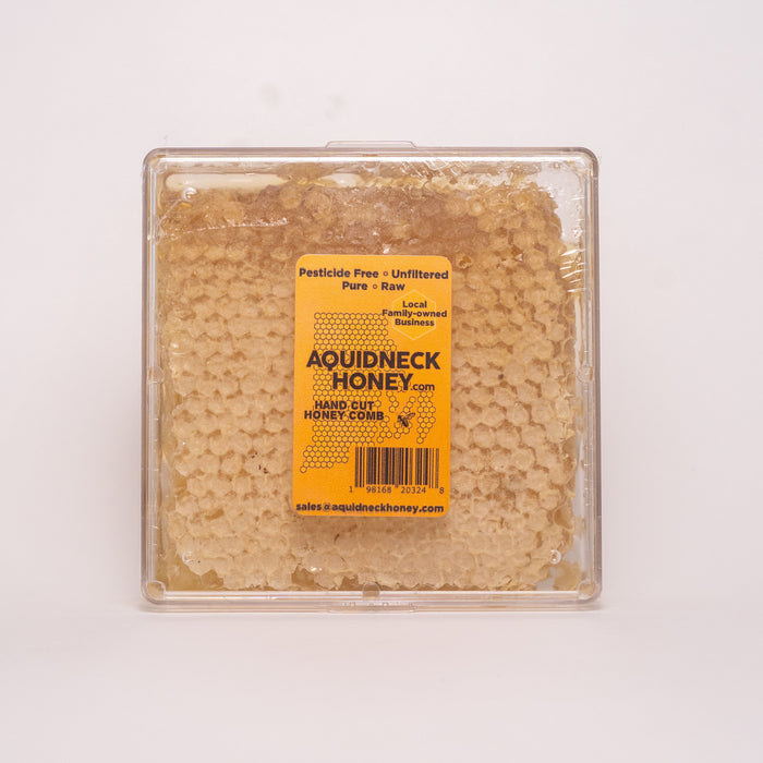 Square container of raw New England honeycomb