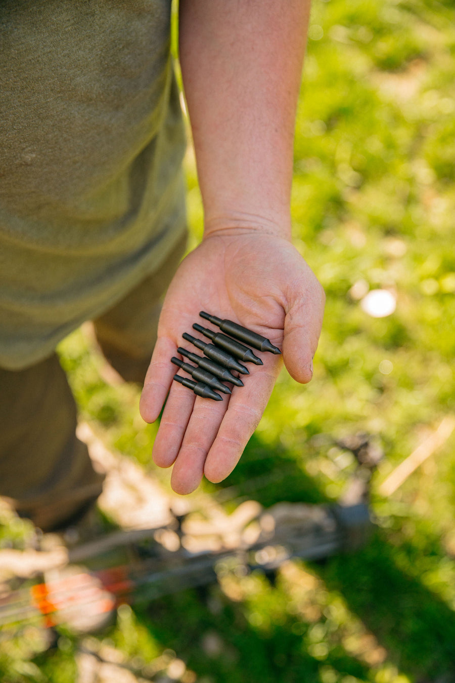 Field points held in a hand outdoors