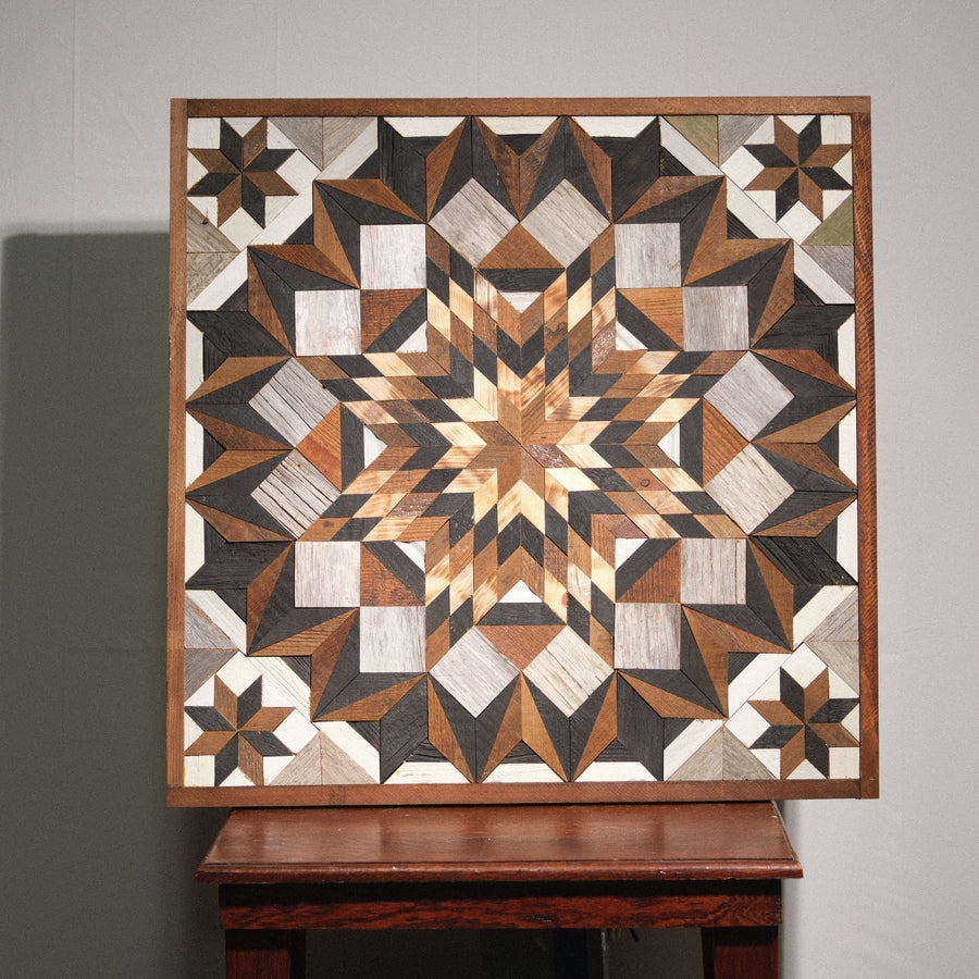 Individual reclaimed-wood barn quilt with a hand-painted geometric star design