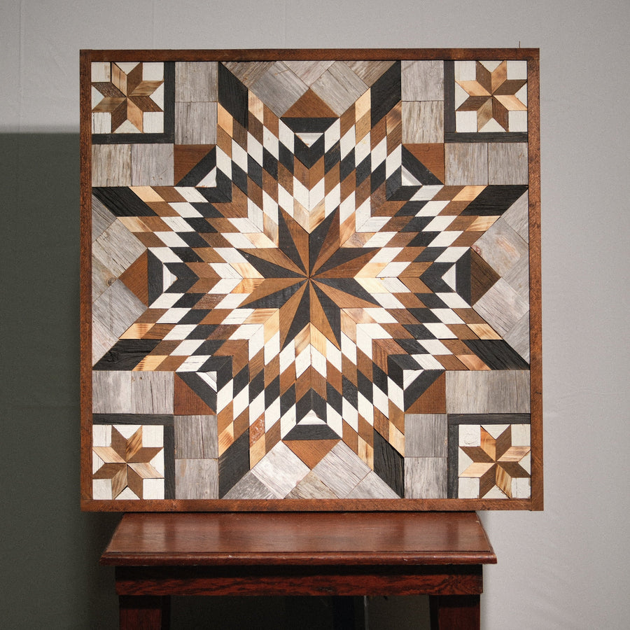 Individual reclaimed-wood barn quilt with a hand-painted geometric star design