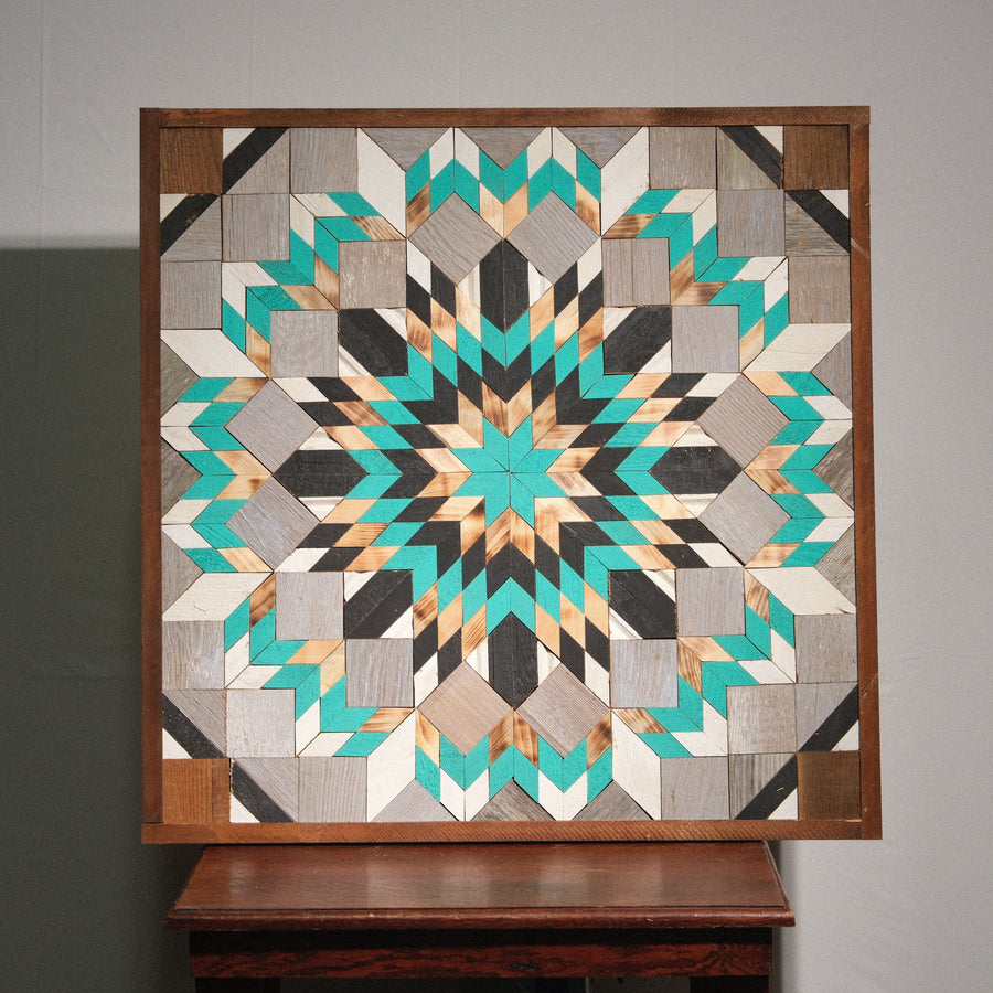 Individual reclaimed-wood barn quilt with a hand-painted geometric star design