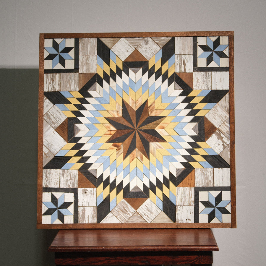Individual reclaimed-wood barn quilt with a hand-painted geometric star design