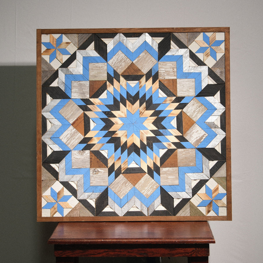Individual reclaimed-wood barn quilt with a hand-painted geometric star design