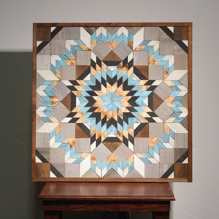 Individual reclaimed-wood barn quilt with a hand-painted geometric star design