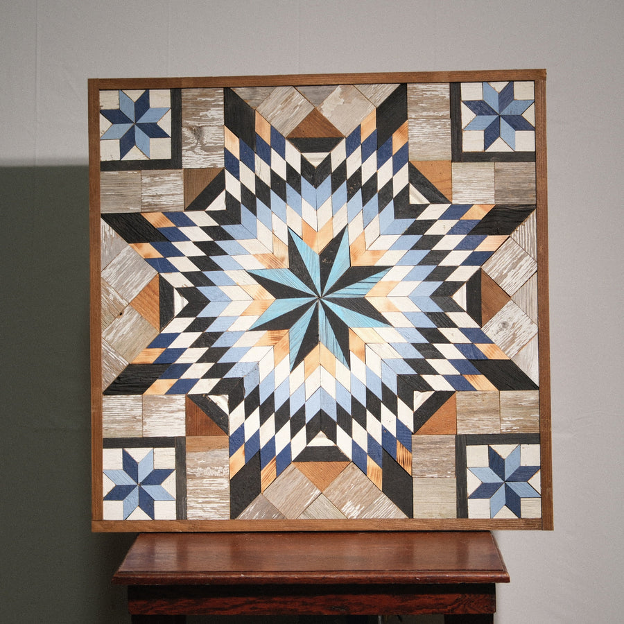 Individual reclaimed-wood barn quilt with a hand-painted geometric star design