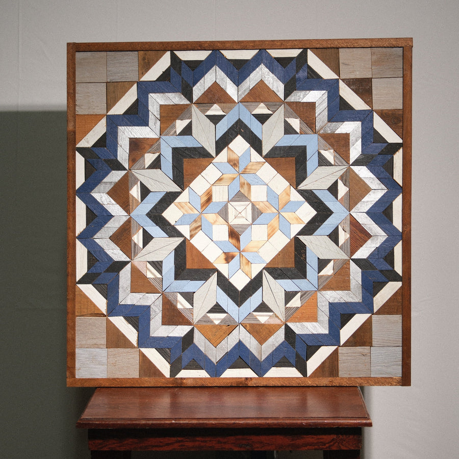 Individual reclaimed-wood barn quilt with a hand-painted geometric star design