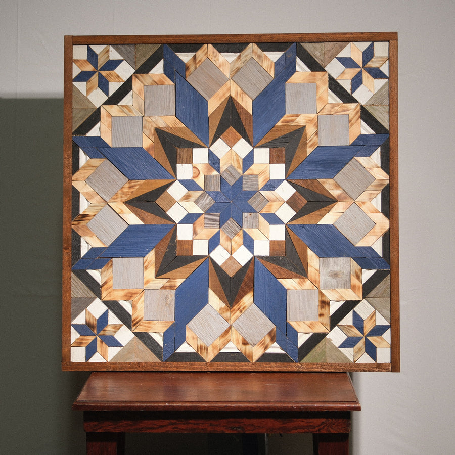 Individual reclaimed-wood barn quilt with a hand-painted geometric star design