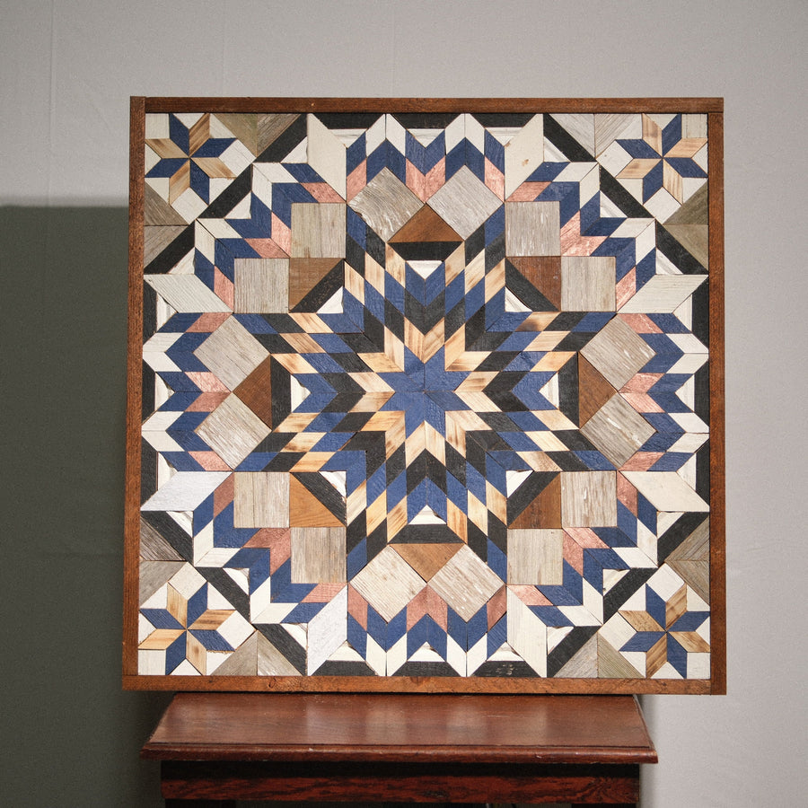 Individual reclaimed-wood barn quilt with a hand-painted geometric star design