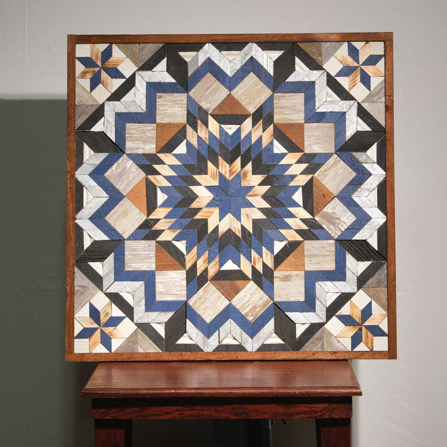 Individual reclaimed-wood barn quilt with a hand-painted geometric star design