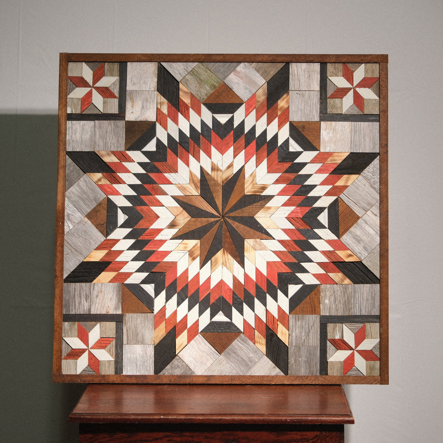 Individual reclaimed-wood barn quilt with a hand-painted geometric star design