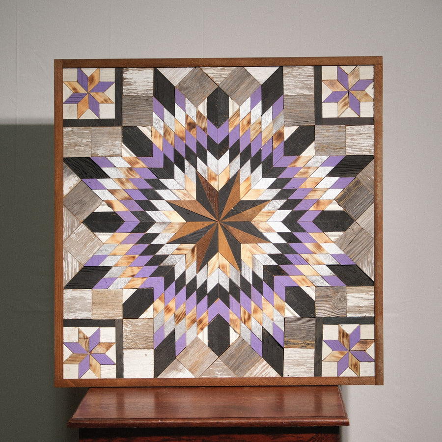 Individual reclaimed-wood barn quilt with a hand-painted geometric star design