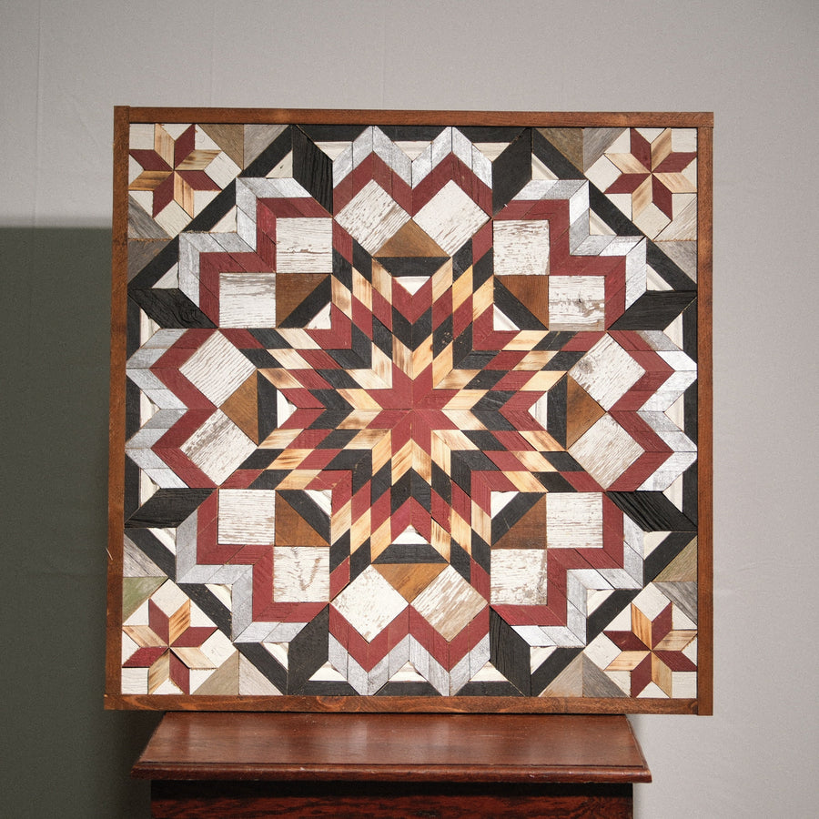 Individual reclaimed-wood barn quilt with a hand-painted geometric star design