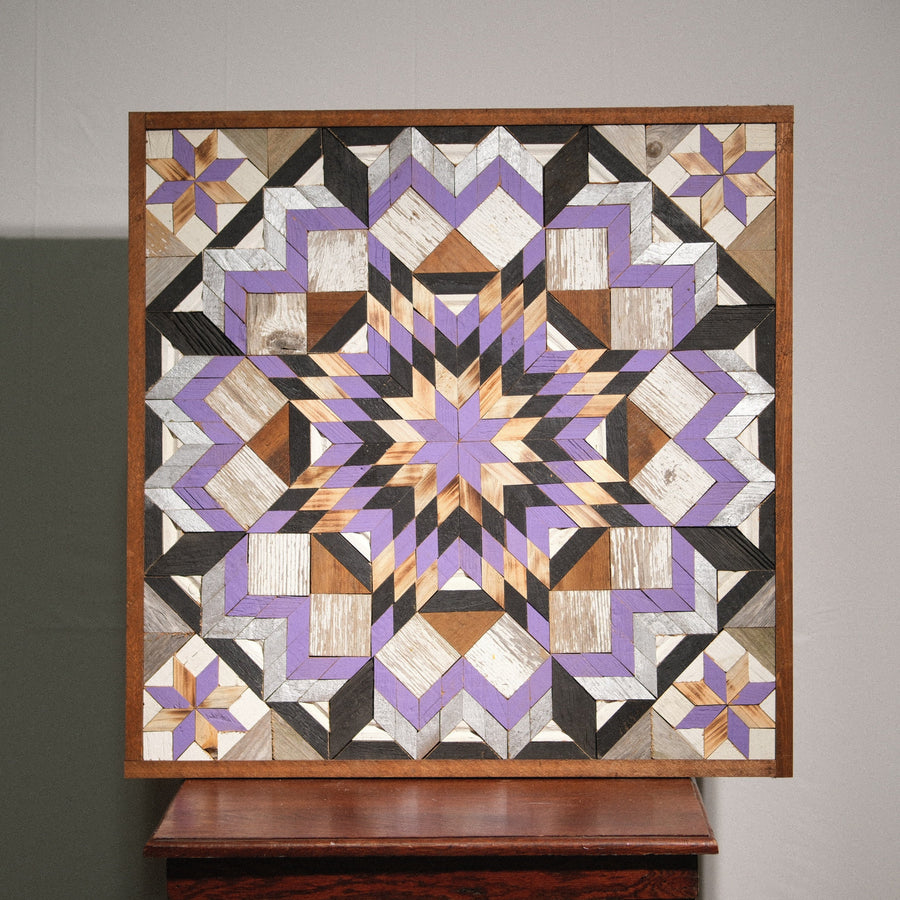 Individual reclaimed-wood barn quilt with a hand-painted geometric star design