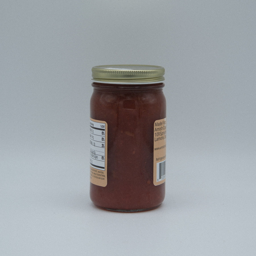 Side of the strawberry rhubarb jam jar showing its product information panels.