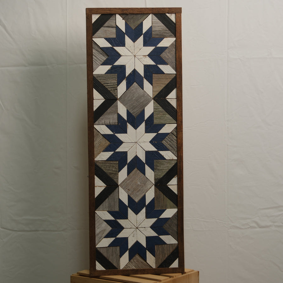 Tall reclaimed-wood barn quilt banner with a hand-painted geometric star design