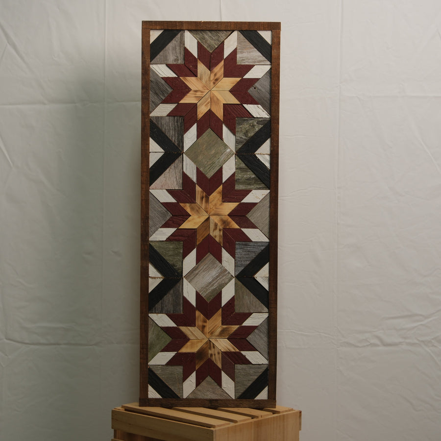 Tall reclaimed-wood barn quilt banner with a hand-painted geometric star design