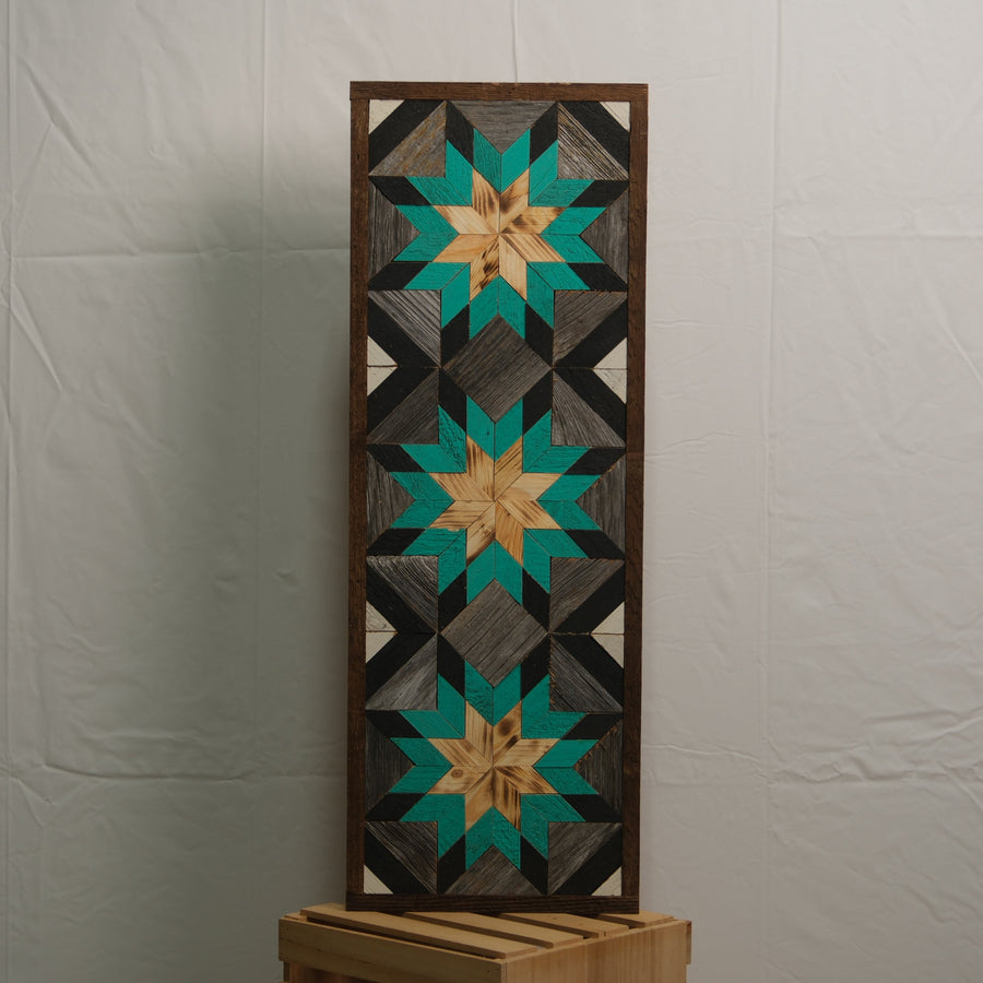 Tall reclaimed-wood barn quilt banner with a hand-painted geometric star design
