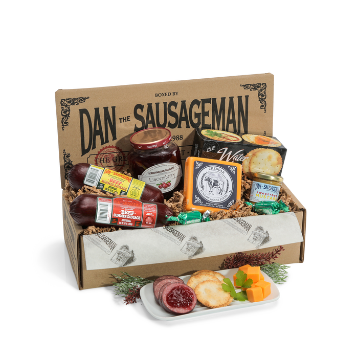 Skandia gift box with two summer sausages, smoked Gouda, lingonberry spread, mustard, crackers and candy