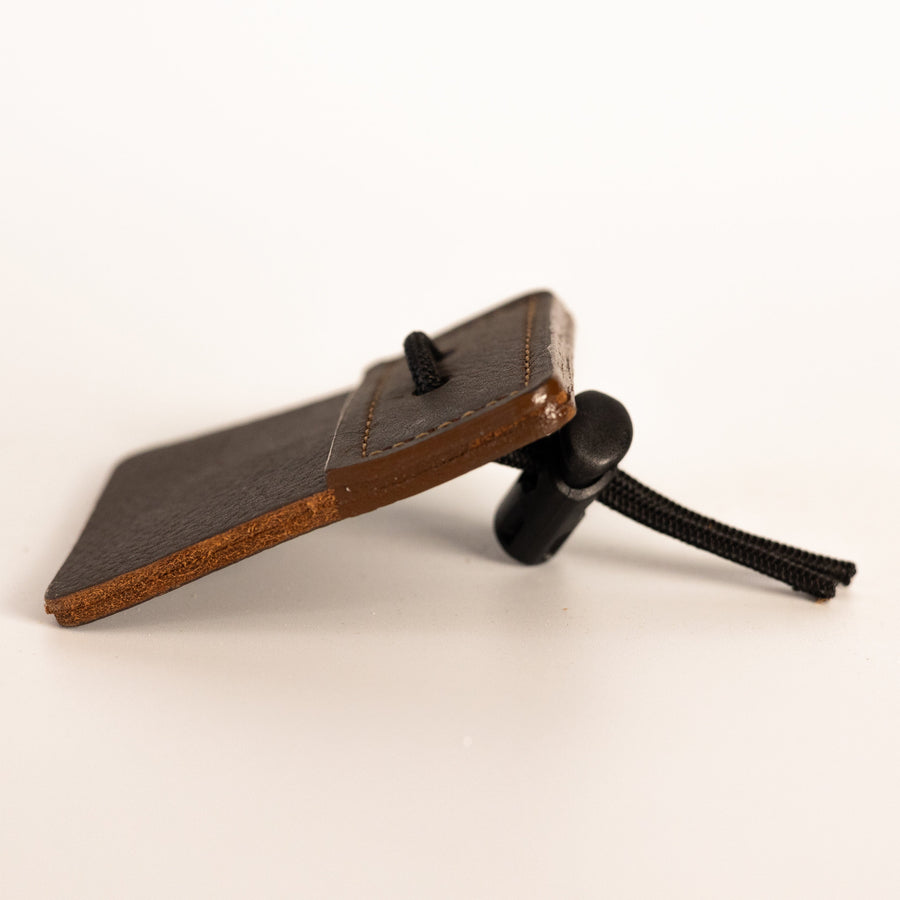 3-Under Leather Archery Tab — edge view of leather tab