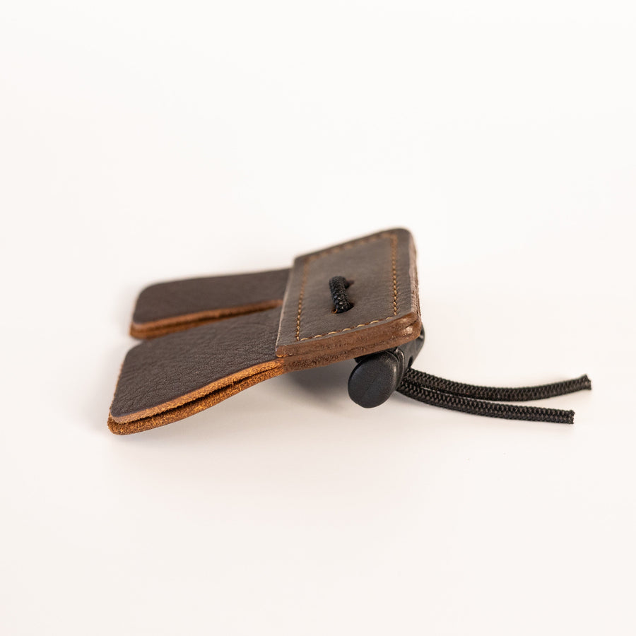 Split-Finger Leather Archery Tab — edge profile of leather tab