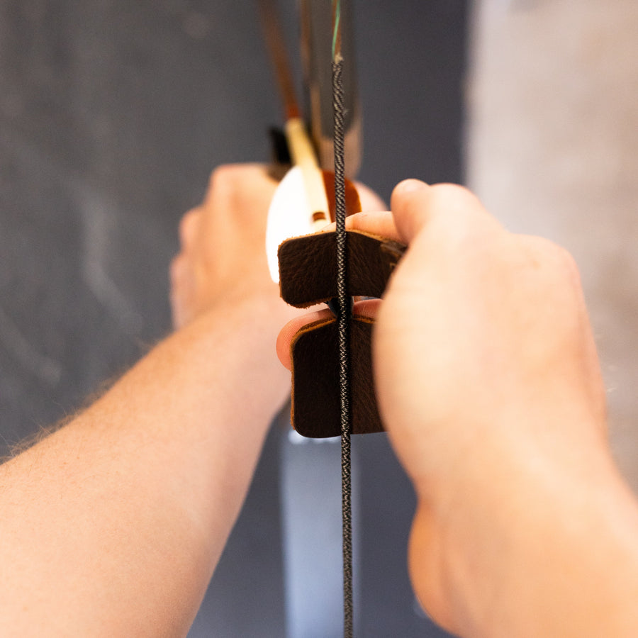 Split-Finger Leather Archery Tab — split-finger tab worn on drawing hand