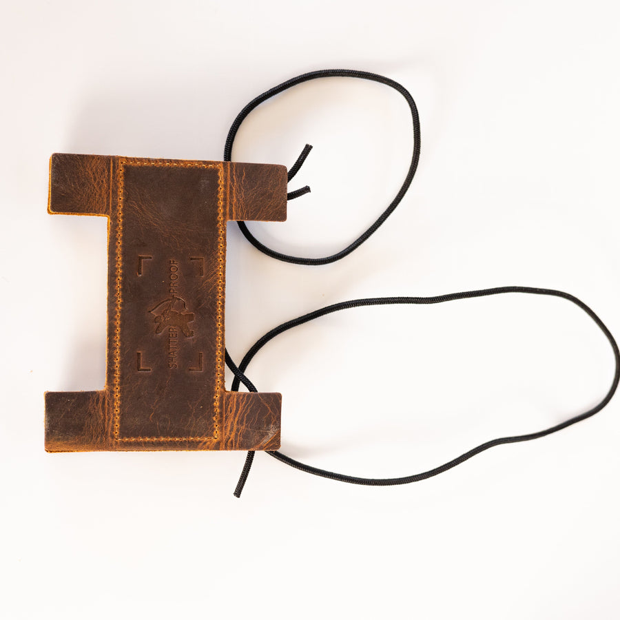 Compact Leather Archery Arm Guard — reverse view of guard and cords