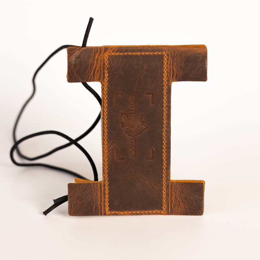 Compact Leather Archery Arm Guard — leather guard laid flat