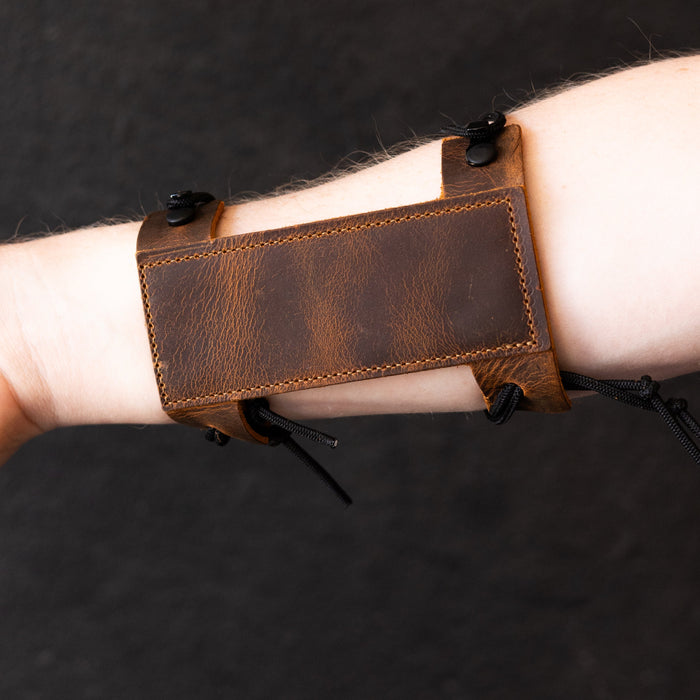 Compact Leather Archery Arm Guard — compact arm guard worn on forearm