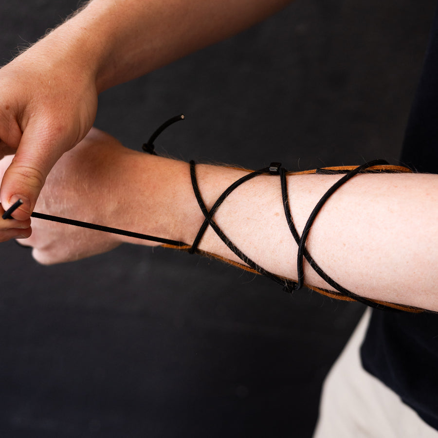 Essential Leather Archery Arm Guard — adjustable lacing around forearm