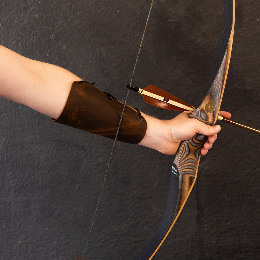 BONES Reflex-Deflex Longbow — longbow held at the grip