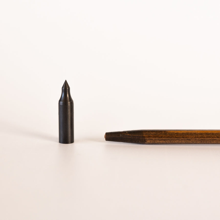 USA-Made Western Larch Wood Arrows — field point beside tapered wooden shaft