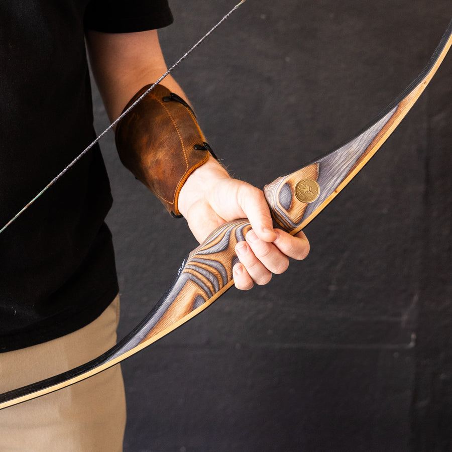BONES Reflex-Deflex Longbow — longbow held by archer
