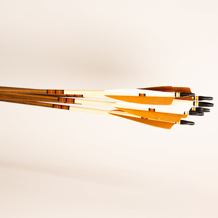 USA-Made Western Larch Wood Arrows — bundle of feather-fletched arrows