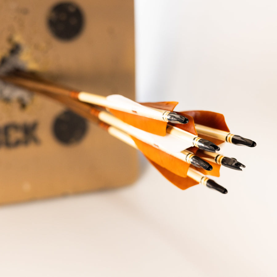 USA-Made Western Larch Wood Arrows — wood arrows held in hand