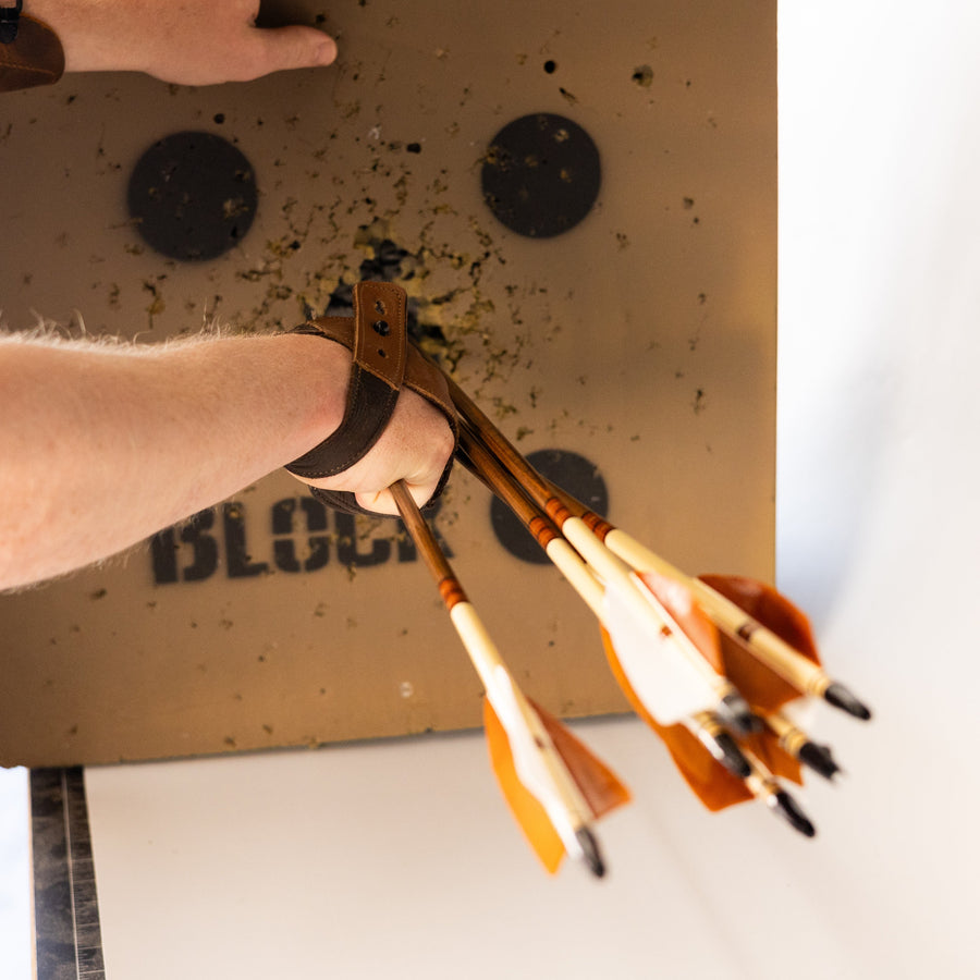 USA-Made Western Larch Wood Arrows — fletched arrows against target